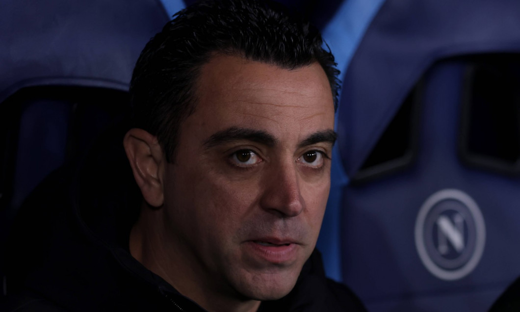 Naples, Italy, 21st February 2024. Xavi Hernandez Head coach of FC Barcelona, Barca looks on from the bench prior to kic