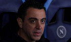 Naples, Italy, 21st February 2024. Xavi Hernandez Head coach of FC Barcelona, Barca looks on from the bench prior to kic