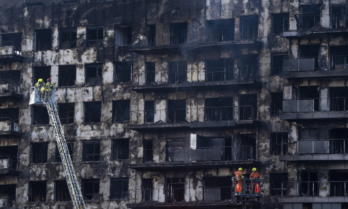 Firefighters search for missing persons in Valencia building fire in which four people are already dead