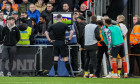 Referee, Mr Chris Kavanagh, checks the VAR screen before awarding Luton Town a penalty during the Premier League match b