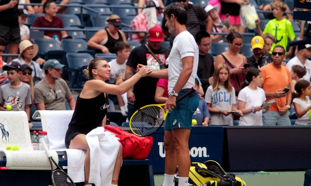 Flushing Meadows, New York, USA. 23rd Aug, 2022. Romania's Simona Halep clasps hands with her new coach, Patrick Mouratoglou while practicing for the U.S. Open today at the National Tennis Center in Flushing Meadows, New York. The tournament begins next M
