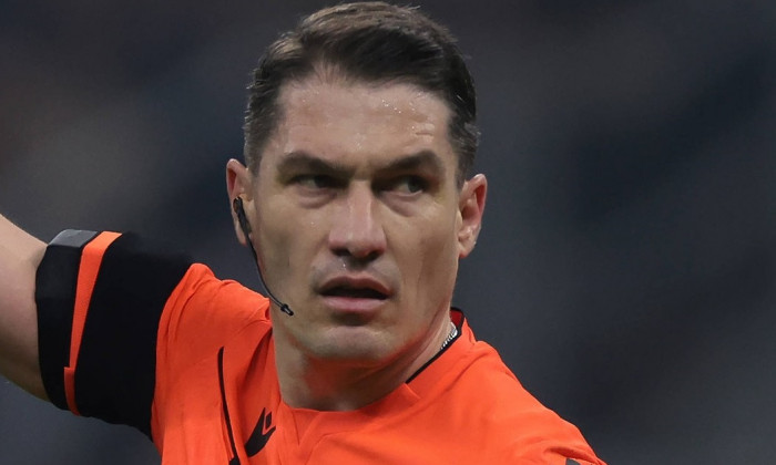 Milan, Italy, 20th February 2024. The Referee Istvan Kovacs of Romania reacts during the UEFA Champions League match at
