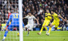 Brahim Diaz of Real Madrid CF (L) attempts a kick while being defended by Alex Baena (C) and Alfonso Pedraza of Villarre