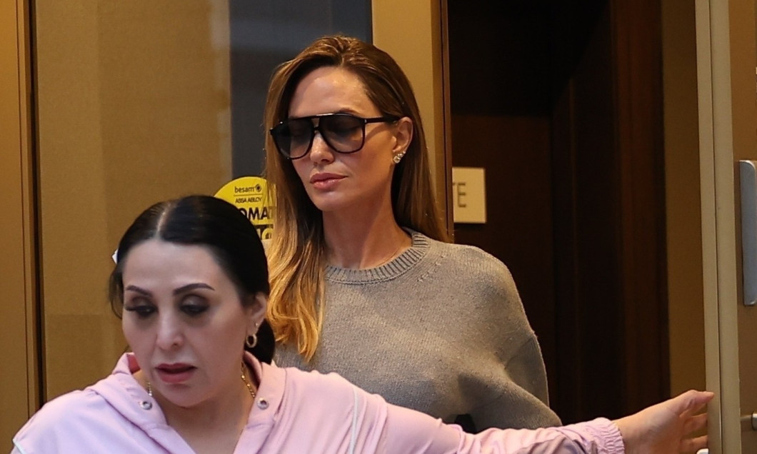 *EXCLUSIVE* Busy Angelina Jolie stops to visit a friend's apartment in LA