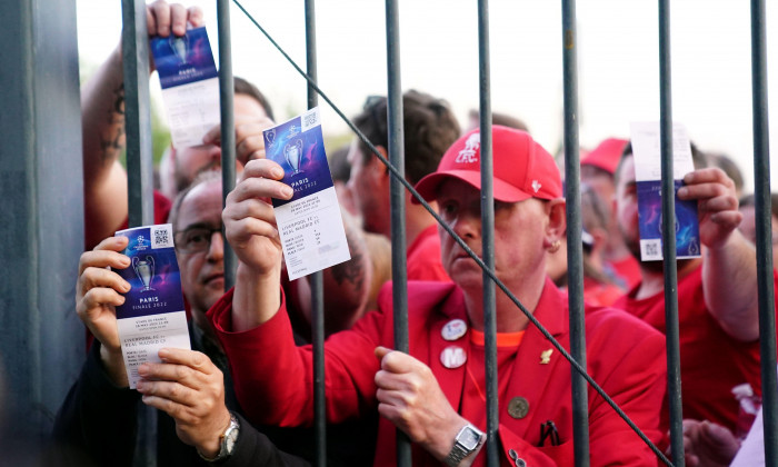 File photo dated 28-05-2022 of Liverpool fans stuck outside the ground showing their match tickets before the UEFA Champions League Final at the Stade de France, Paris. French interior minister Gerald Darmanin has apologised to "everyone who suffered from