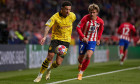 MADRID, SPAIN - APRIL 10: Jadon Sancho, Left Winger of Borussia Dortmund competes for the ball with Antoine Griezmann, Centre-Forward of Atletico de Madrid during to the UEFA Champions League quarter-final first leg match between Atletico de Madrid and Bo