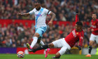 Manchester United, ManU v Crystal Palace, Manchester, UK - 30 Sep 2023 Jordan Ayew of Crystal Palace is challenged by Ca