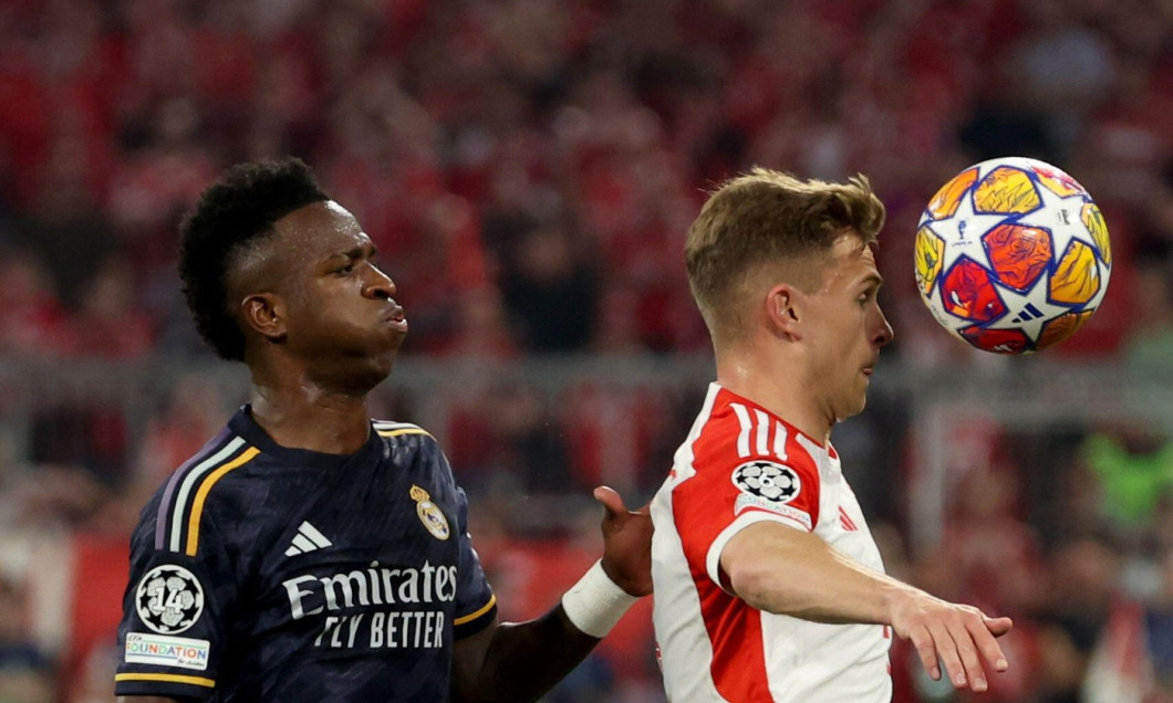 Munich, Germany. 30th Apr, 2024. Soccer: Champions League, FC Bayern Munich - Real Madrid, knockout round, semi-final, first leg, Allianz Arena. Munich's Joshua Kimmich (r) and Madrid's Vinicius Junior fight for the ball. Credit: Matthias Balk/dpa/Alamy L