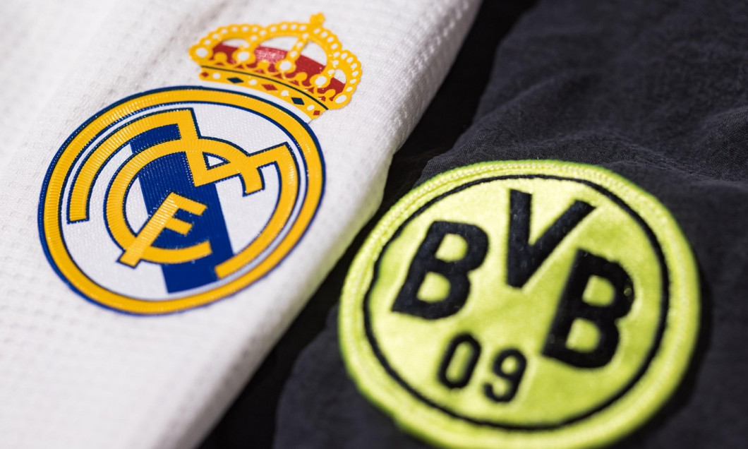 Defocused Borussia Dortmund shield next to the focused Real Madrid shield on their shirt. Final concept of the UEFA Champions League on June 1, 2024