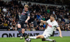 Kevin De Bruyne of Manchester City is tackled by Radu Draguin of Tottenham Hotspur during the Premier League match Tottenham Hotspur vs Manchester City at Tottenham Hotspur Stadium, London, United Kingdom, 14th May 2024(Photo by Mark Cosgrove/News Image