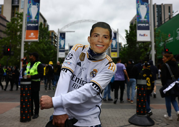 London, England, 1st June 2024. A Real Madrid fans wears a former player Christiano Ronaldo mask before the UEFA Champio