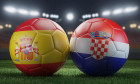 Two soccer balls in flags colors on a stadium blurred background. Group B. Spain and Croatia. 3D image.