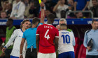 Düsseldorf Arena Referee Jesus Gil Manzano (L) shows a yellow card for Kylian MbappĂ of France (R) during the UEFA EURO,