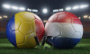 Two soccer balls in flags colors on a stadium blurred background. Romania vs Netherlands. 3D image.