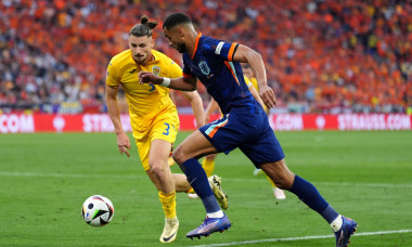 Romania's Radu Dragusin and Netherlands's Cody Gakpo battle for the ball during the UEFA Euro 2024, round of 16 match at the Munich Football Arena in Munich, Germany. Picture date: Tuesday July 2, 2024.