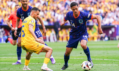 Munich, Germany. 02nd July, 2024. MUNICH, GERMANY - JULY 2: Marius Marin of Romania battles for possession with Tijjani Reijnders of the Netherlands during the Round of 16 - UEFA EURO 2024 match between Romania and Netherlands at Munich Football Arena on