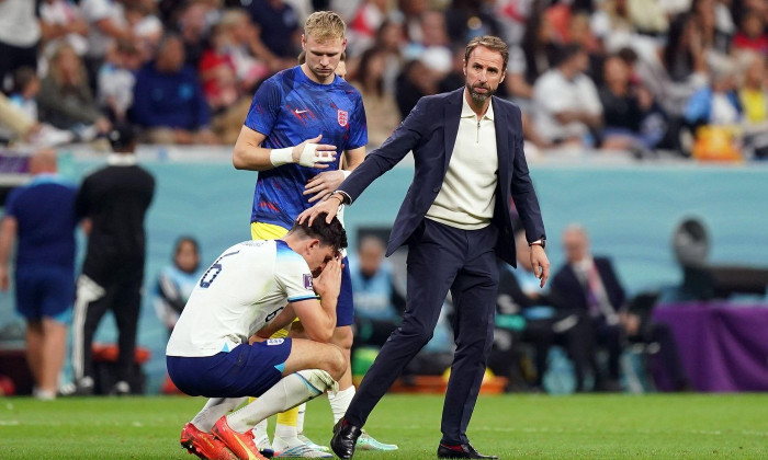 England's Harry Maguire is consoled by manager Gareth Southgate following defeat in the FIFA World Cup Quarter-Final match at the Al Bayt Stadium in Al Khor, Qatar. Picture date: Saturday December 10, 2022.