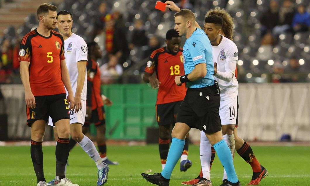 231119 Belgium vs Azerbaijan Eddy of Azerbaijan receives a red card from referee Gergo Bogar during a football game betw