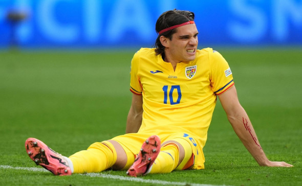 Romania's Ianis Hagi with an injured arm during the UEFA Euro 2024, round of 16 match at the Munich Football Arena in Munich, Germany. Picture date: Tuesday July 2, 2024.