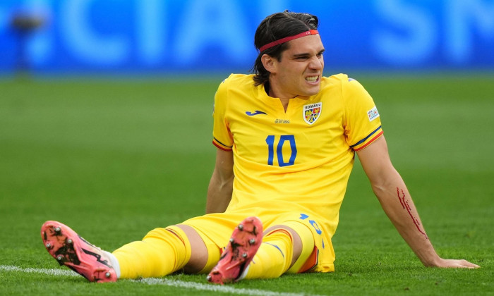 Romania's Ianis Hagi with an injured arm during the UEFA Euro 2024, round of 16 match at the Munich Football Arena in Munich, Germany. Picture date: Tuesday July 2, 2024.