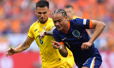 Romania's Marius Marin (left) and Netherlands's Xavi Simons battle for the ball during the UEFA Euro 2024, round of 16 match at the Munich Football Arena in Munich, Germany. Picture date: Tuesday July 2, 2024.