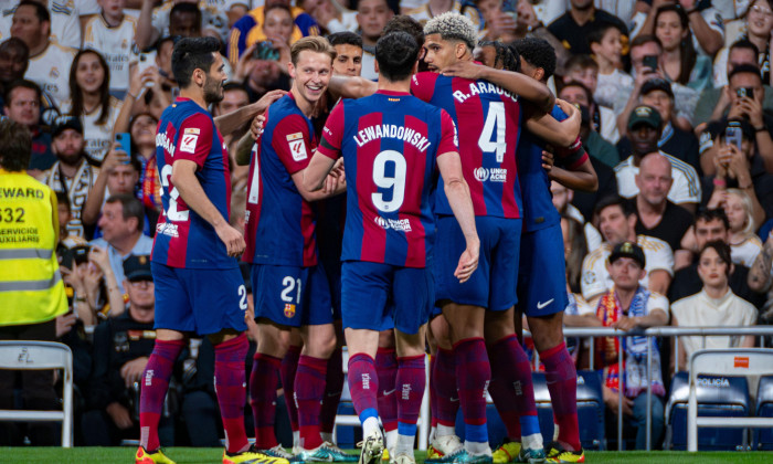 Madrid, Spain. 21st Apr, 2024. FC Barcelona players (from L to R) Ilkay Gundogan, Frenkie De Jong, Robert Lewandowski, Ronald Araujo seen celebrating a goal during the La Liga EA Sports 2023/24 football match between Real Madrid vs FC Barcelona at Estadio