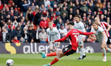 Lincoln City's Daniel Mandroiu slips as he takes his spot kick during the Sky Bet League One match at the LNER Stadium, Lincoln. Picture date: Saturday April 27, 2024.