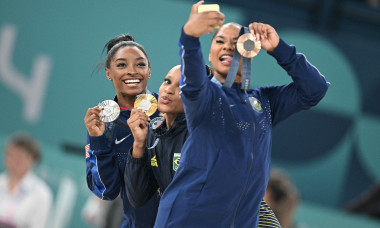 Paris, France. 05th Aug, 2024. (L to R) Silver Medallist Simone Biles of Team United States, Gold Medallist Rebeca Andrade and Bronze medallist Jordan Chiles of Team USA pose during the podium ceremony for the artistic gymnastics women's floor exercise ev