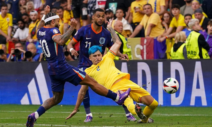 Munchen, Germany. 02nd July, 2024. MUNCHEN, GERMANY - JULY 2: Memphis Depay of Netherlands, Cody Gakpo of Netherlands, Andrei Ratiu of Romania during the UEFA EURO 2024 Round of 16 match between Romania and Netherlands at Allianz Arena on July 2, 2024 in