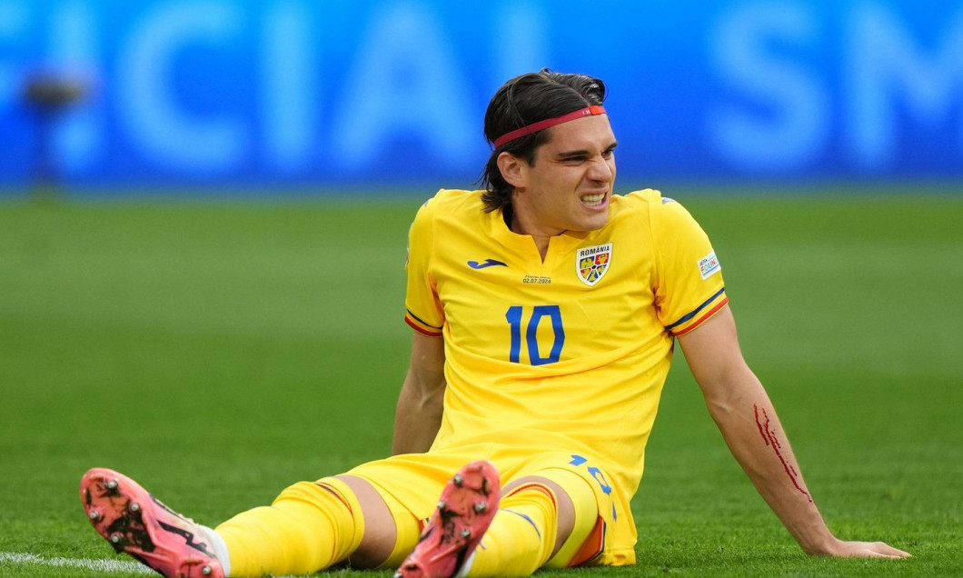 Romania's Ianis Hagi with an injured arm during the UEFA Euro 2024, round of 16 match at the Munich Football Arena in Munich, Germany. Picture date: Tuesday July 2, 2024.