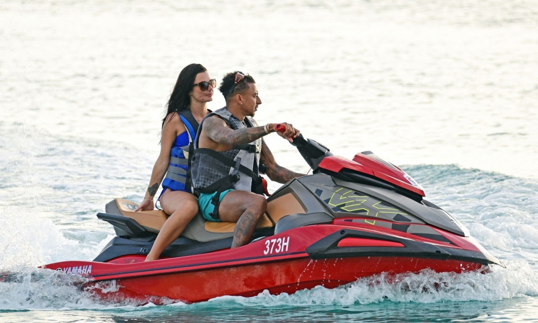 *EXCLUSIVE* WEB MUST CALL FOR PRICING - Shirtless Former Manchester United footballer Jesse Lingard pictured on the beach with two girls while on holiday in Barbados.