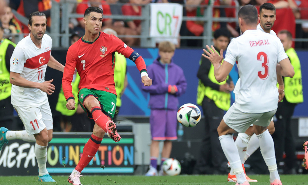 Dortmund, Germany, 22nd June 2024. Yusuf Yazici and Merih Demiral of Turkey close in as Cristiano Ronaldo of Portugal cr