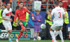 Dortmund, Germany, 22nd June 2024. Yusuf Yazici and Merih Demiral of Turkey close in as Cristiano Ronaldo of Portugal cr