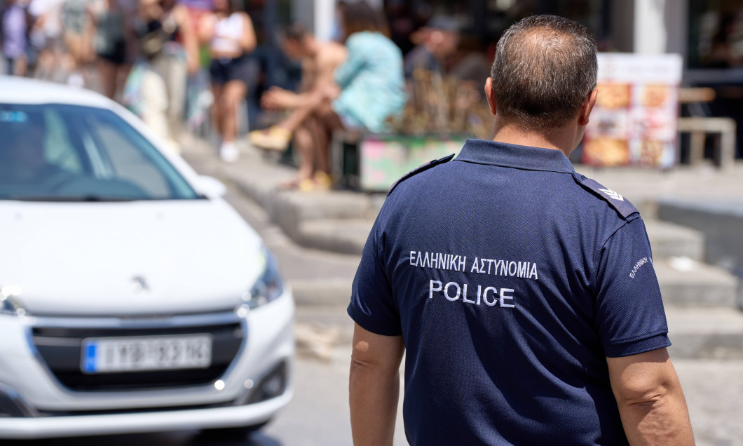 Thira, Santorini, Greece - May 8, 2024: Policeman in uniform of the Greek police. Police on patrol in Greece *** Polizis