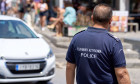 Thira, Santorini, Greece - May 8, 2024: Policeman in uniform of the Greek police. Police on patrol in Greece *** Polizis