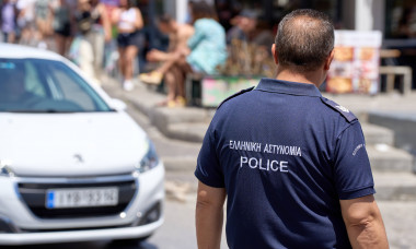 Thira, Santorini, Greece - May 8, 2024: Policeman in uniform of the Greek police. Police on patrol in Greece *** Polizis