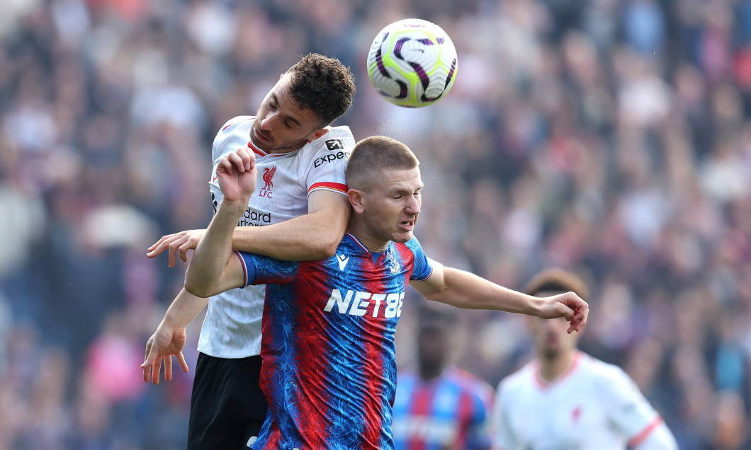 London, England, 5th October 2024. Diogo Jota of Liverpool and Adam Wharton of Crystal Palace /ch during the Premier Lea