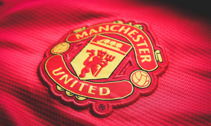 Manchester United. Logo embroidered on the T-shirt. Red Devil Football Club of England. Royal Football Club.