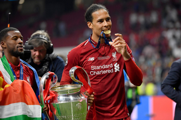 Madrid, Spain. 01st June, 2019. Liverpool's player Virgil Van Dijk of Liverpool FC celebrate with the trophy at the end of the during the 2019 UEFA Champions League Final match between Tottenham Hotspur and Liverpool at Wanda Metropolitano Stadium, Madrid