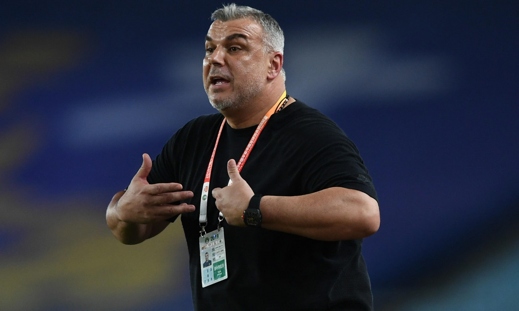 Head coach Cosmin Olaroiu of Jiangsu Suning reacts as he watches his players competing against Henan Jianye in their 22nd round match during the 2019 Chinese Football Association Super League (CSL) in Nanjing city, east China's Jiangsu province, 13 August