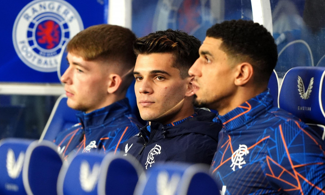 Rangers' Ianis Hagi (centre) in the dugout ahead of the William Hill Premiership match at Ibrox Stadium, Glasgow. Picture date: Sunday October 6, 2024.