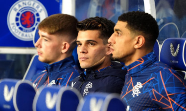 Rangers' Ianis Hagi (centre) in the dugout ahead of the William Hill Premiership match at Ibrox Stadium, Glasgow. Picture date: Sunday October 6, 2024.