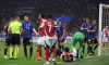 Milan, Italy, 6th November 2024. Yann Bisseck of FC Internazionale and Kai Havertz of Arsenal FC lay injured following a