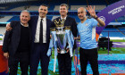 Manchester City manager Pep Guardiola alongside chairman Khaldoon Al Mubarak, Chief Executive Ferran Soriano and Director of Football, Txiki Begiristain with the Premier League trophy following the the Premier League match at The Etihad Stadium, Mancheste