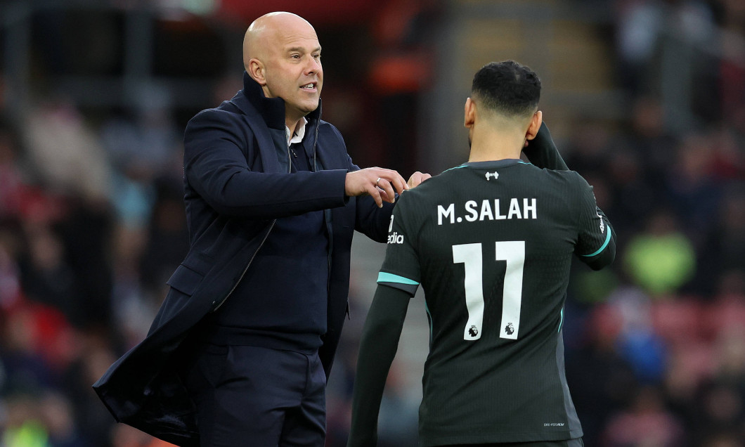 Southampton, England, 24th November 2024. Arne Slot, manager of Liverpool gives instructions to Mohamed Salah of Liverpo