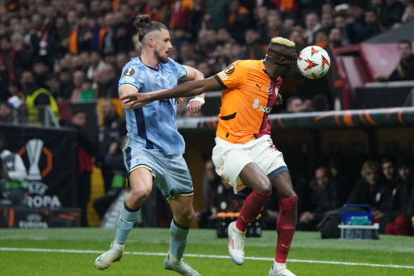 Victor Osimhen (R) of Galatasaray and Radu Dragusin (L) of Tottenham Hotspur battle for the ball during the UEFA Europa