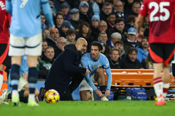 Pep Guardiola manager of Manchester City gives instructions to Jack Grealish of Manchester City before he goes on as a substitute during the Premier League match Manchester City vs Manchester United at Etihad Stadium, Manchester, United Kingdom, 15th Dece