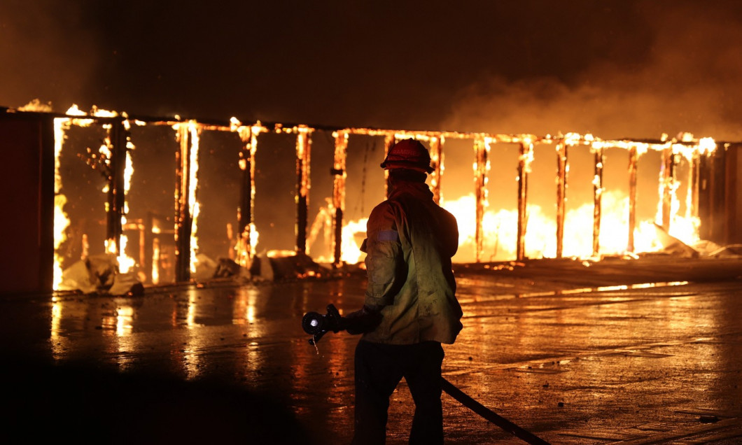 Firefighters continue battling Palisades fire in Los Angeles as flames rage out of control