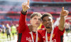 London, England 25th May 2024: Alejandro Garnacho of Man Utd and Amad Diallo of Man Utd with medals pointing to stands a