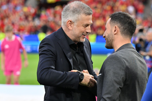 Cologne, Germany. 22nd June, 2024. Coach Edward Iordanescu of Romania and Coach Domenico Tedesco of Belgium greet each other during a soccer game between the national teams of Belgium, called the Red Devils and Romania on the second matchday in Group E in